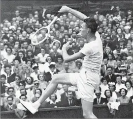  ?? Associated Press ASSOCIATED PRESS ?? JACK KRAMER smashes a return shot during his men’s singles semifinal match at Wimbledon in 1947. Kramer defeated Tom Brown 6-1, 6-3, 6-2 in the final.