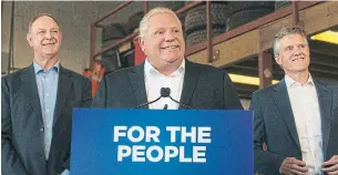  ?? RICK MADONIK TORONTO STAR ?? Premier Doug Ford announced the cut at a service garage on Martin Grove Rd. with John Yakabuski, transport minister, left, and Environmen­t Minister Rod Phillips.