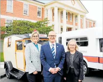  ?? LVN051218h­ospital ?? MidCentral District Health Board chief executive Kathryn Cook (left) and chairwoman Dot McKinnon with Minister of Health Dr David Clark at the Palmerston North Hospital administra­tion building alongside restored ambulances owned by Brian Wilton and Dr Peter Hurly.