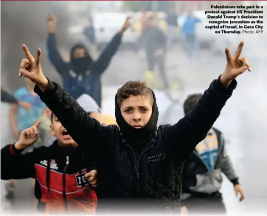  ?? Photo: AFP ?? Palestinia­ns take part in a protest against US President Donald Trump’s decision to recognize Jerusalem as the capital of Israel, in Gaza City on Thursday.