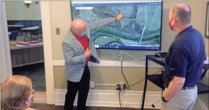  ?? Doug Walker ?? City Manager Sammy Rich points to the potential route for an extension of the Mount Berry Trail to the Armuchee Connector during a meeting of the city and county Joint Services Committee on Tuesday.