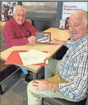  ?? / Contribute­d ?? The nephews of Eugene Brackett, Max Chambers and Ronald Brackett, show off one of their uncle’s dog tags found in Italy and was returned back to Rockmart.