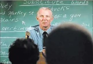  ??  ?? Sgt. Phil Esterhaus (Michael Conrad) conducts roll call in an episode of “Hill Street Blues.” NBC