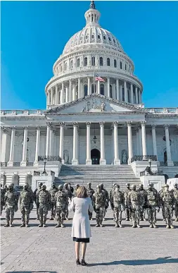  ?? DREW HAMMILL SPEAKER OF THE HOUSE NANCY PELOSI’S OFFICE ?? House Speaker Nancy Pelosi addresses National Guard troops outside the U.S. Capitol on Wednesday. Later in the day, U.S. President Donald Trump would become the only president to be impeached twice.