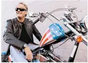  ?? CHRIS PIZZELLO/AP 2009 ?? Peter Fonda, who rode a chopper called “Captain America” in “Easy Rider,” sits atop a motorcycle in California.