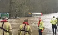  ??  ?? In deep water The bus became trapped in flood waters outside Dailly