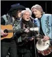  ?? MARK HUMPHREY - THE ASSOCIATED PRESS ?? Marty Stuart, center, performs with members of his band, the Fabulous Superlativ­es, during Marty Stuart’s Late Night Jam at the Ryman Auditorium Thursday, in Nashville, Tenn. For 17 years, the unofficial start of one of the biggest weeks for fans of...