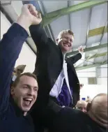  ??  ?? Malcolm Byrne celebrates on the shoulders of happy supporters.