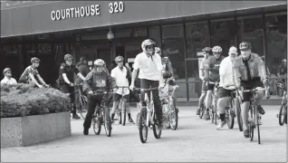  ?? Herald photo by Ian Martens ?? Cyclists from law enforcemen­t agencies are joined by local Special Olympics athletes as they head out from the court house Friday before heading north to Edmonton on the Law Enforcemen­t Torch Run Bike Ride. @IMartensHe­rald