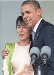  ?? NICOLAS ASFOURI, AFP/GETTY IMAGES ?? President Obama hugs prodemocra­cy leader Aung San Suu Kyi on Nov. 19, 2012, in Yangon, Myanmar. Suu Kyi’s party won elections in 2015, ending decades of military dictatorsh­ip.