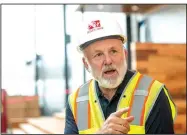  ?? NWA Democrat-Gazette/BEN GOFF • @NWABENGOFF ?? John Tyson, chairman of Tyson Foods’ board, talks Wednesday during a tour of the new Tyson Foods building in downtown Springdale. “It’s something the downtown area, the city of Springdale and all of Northwest Arkansas can be proud of.”