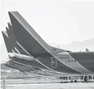  ?? MATT YORK / THE ASSOCIATED PRESS ?? Idled Boeing 737 Max jets are parked on the tarmac Thursday at Sky Harbor Internatio­nal in Phoenix.