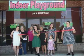  ?? / Kevin Myrick ?? The Polk County Chamber of Commerce welcomed its new business to Cedartown during a ribbon cutting event on Friday, June 22. The storefront provides for now an indoor playground for infants to children age 6, but plans are to expand in the future.