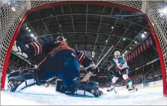  ?? MARISSA BAECKER/shootthebr­eeze.ca ?? Connor Ingram of the Kamloops Blazers defends the net from a shot by Carsen Twarynski of the Kelowna Rockets during WHL playoff action at Prospera Place in Kelowna on Friday. Kamloops won 4-1 but Kelowna still leads the best-of-seven series 3-2.