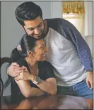  ??  ?? John Paul Garcia, 20, hugs his mother March 12 at their home in Burlington, N.C.