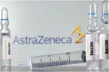 ??  ?? A test tube labelled “vaccine” in front of an Astrazenec­a logo