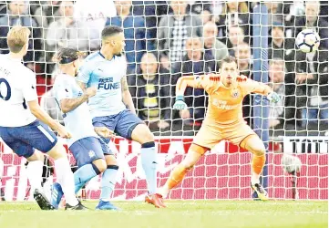  ?? — Reuters photo ?? Tottenham’s Harry Kane (left) scores a goal during English Premier League match against Newcastle United at Wembley Stadium in London.