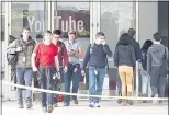  ?? FILE PHOTO ?? YouTube employees are escorted in and out of their building on April 4, one day after a disgruntle­d YouTube user shot three people and killed herself on the campus in San Bruno.