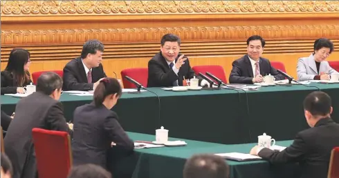  ?? SHENG JIAPENG / XINHUA ?? Xi Jinping, general secretary of the Communist Party of China Central Committee, speaks at a panel discussion with deputies to the National People’s Congress from Guangdong province at the Great Hall of the People in Beijing on Wednesday.