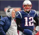  ?? MADDIE MEYER / GETTY IMAGES ?? An ESPN report implied Patriots quarterbac­k Tom Brady (right) has taken issue with a lack of praise this season from coach Bill Belichick.