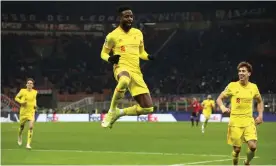  ?? Photograph: Marco Luzzani/Getty Images ?? Divock Origi celebrates scoring Liverpool’s winner against Milan at San Siro, a goal that helped secure his side’s sixth consecutiv­e win in Group B.