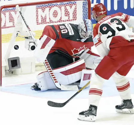  ?? PHOTO AFP ?? Peter Regin a déjoué le gardien canadien Chris Driedger, hier, dans un gain des Danois au Mondial.