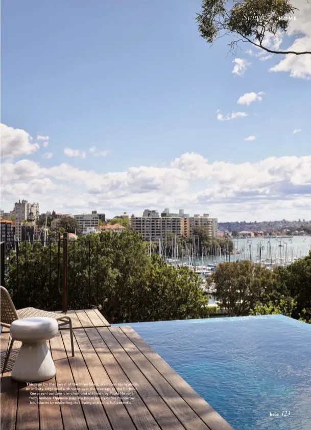  ??  ?? This page On the lowest of the three levels, a rumpus room abuts an infinity-edge pool with views over the treetops to the harbour. Gervasoni outdoor armchair and ottoman by Paola Navone from Anibou. Opposite page The house boldly defies its narrow boundaries by exploiting its sloping site to its full potential.