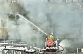  ?? SUSHIL KUMAR/HT PHOTO ?? As soon as the fire at Lok Nayak Bhawan started, the New Delhi Municipal Council control room inside the building dispatched their firefighte­rs, who later got trapped inside as smoke filled the entire fourth floor.