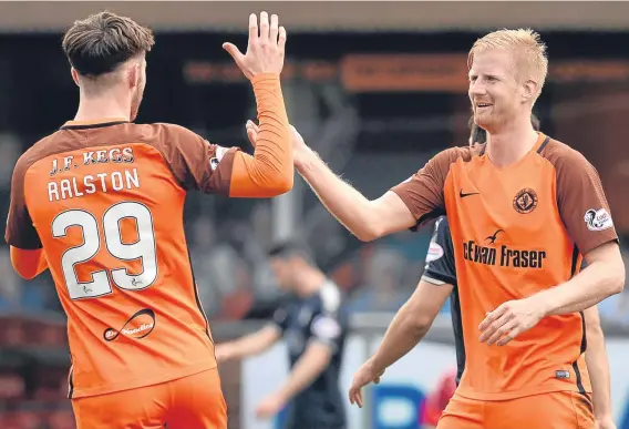  ??  ?? Dundee United manager Csaba Laszlo reserved special praise for the recent performanc­es of Danish striker Thomas Mikkelsen (right).