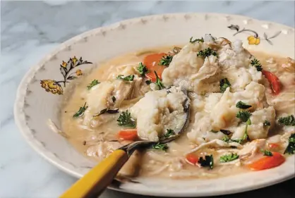  ?? GORAN KOSANOVIC THE WASHINGTON POST ?? Sheri's shortcut chicken stew with fluffy dumplings.
