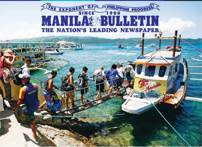  ?? (Juan Carlo de Vela) ?? LAST TRIP – Tourists in Boracay board a pumpboat that will bring them to the mainland Wednesday. It will be six months before the island resort can welcome back visitors.