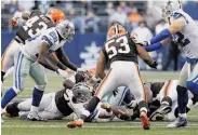  ?? Sharon Ellman / Associated Press ?? Dallas quarterbac­k Tony Romo (on ground at center) fumbles, but the Cowboys overcame it.