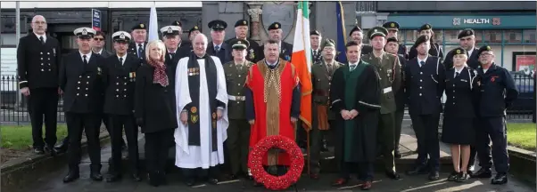  ??  ?? At the wreath laying at Redmond Monument following the ecumenical Remembranc­e Day service in St Iberius Church.