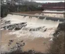  ?? TANIA BARRICKLO — DAILY FREEMAN FILE ?? Muddy water comes over the Cantine Dam falls on the Lower Esopus
Creek, near the Diamond Mills Hotel, in Saugerties, N.Y., on Jan. 11.