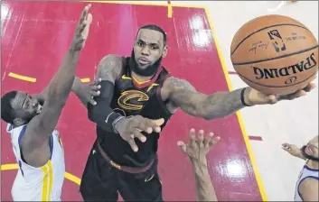  ?? AP PHOTO ?? Cleveland Cavaliers star LeBron James takes a shot against Golden State Warriors forward Draymond Green in Game 3 the NBA Finals in June.