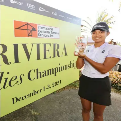  ?? PHOTOGRAPH COURTESY OF LPGT ?? DANIELLA Uy shows off the trophy she won after scoring her first pro victory at the ICTSI Riviera Ladies Championsh­ip at the Riviera Golf and Country Club in Silang, Cavite.