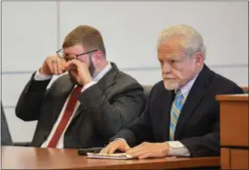  ?? ERIC BONZAR —THE MORNING JOURNAL ?? Alongside his attorney James Burge, Jeremiah K. Donovan, of Elyria, wipes away tears during a status hearing in front of Lorain County Common Pleas Judge Mark A. Betleski on April 24. On April 21, Betleski found Donovan guilty of one count of attempted...