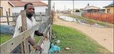  ?? Picture: JUDY DE VEGA ?? HEALTH FEARS: Vonathi Lukhwe, 57, has sewage pooling in the street in front of his home in Mthamvuna Street, Wells Estate