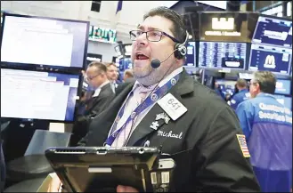  ??  ?? Trader Michael Capolino works on the floor of the New York Stock Exchange, Tuesday, on July 10. Energy and industrial companies are leading stocks higher in early trading on Wall Street following three straight days
of gains for the market. (AP)