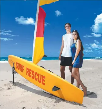  ??  ?? Liam Towner and Emily McClymont have returned to Fingal Head to thank the surf lifesavers who helped in their rescue at Dreamtime Beach on January 18.