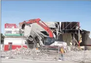  ??  ?? Farmington School District tore down the old high school gym in May.