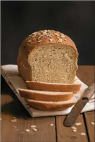  ?? PHOTO COURTESY OF DONOVAN ROBERTS WITMER AND HERALD PRESS ?? The author’s daughter counts oatmeal bread among her favorites.