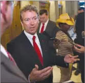  ??  ?? U.S. Sen. Rand Paul, R-Ky., talks with reporters Sunday outside of the Senate Chamber following his address to the Senate in Washington. Senate Republican­s say they’ve been unable to make a deal to extend contested anti-terror provisions. As a result,...