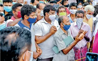  ??  ?? President Gotabaya Rajapaksa listening to the people’s grievances when they arrived in Anura
for the August 5 general elections