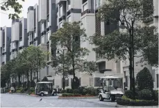  ?? Bloomberg ?? Golf carts can sell for more than HK$2m in Discovery Bay, where homes start at about HK$8m