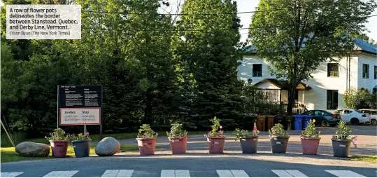  ?? (Yoon Byun/The New York Times) ?? A row of flower pots delineates the border between Stanstead, Quebec, and Derby Line, Vermont.