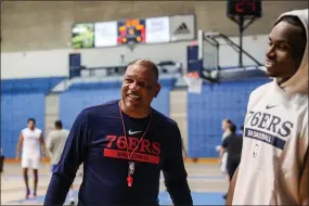  ?? THE ASSOCIATED PRESS ?? Philadelph­ia 76ers coach Doc Rivers speaks with Danuel House after practice during the team’s training camp at The Citadel in Charleston, S.C.