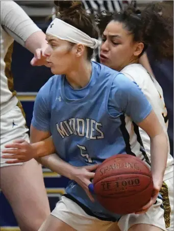  ?? CHRIS CHRISTO — BOSTON HERALD ?? St. Mary’s Yirsy Queliz, right, plays defense against Dracut’s Ashlee Talbot in a regular season clash. St. Mary’s and Dracut will both vie for state titles this weekend.
