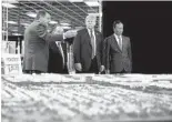  ?? EVAN VUCCI AP ?? President Donald Trump toured Foxconn with Chairman Terry Gou (right) and CEO of SoftBank Masayoshi Son.