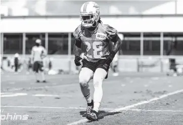  ?? Courtesy of the Miami Dolphins ?? Dolphins safety Bobby McCain is back on the field after undergoing season-ending shoulder surgery in 2019.